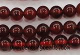 CGA601 15.5 inches 6mm A grade round natural orange garnet beads