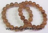 CGB4614 10mm - 11mm round golden rutilated quartz beaded bracelets