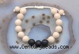 CGB6670 10mm round white fossil jasper & black lava adjustable bracelets